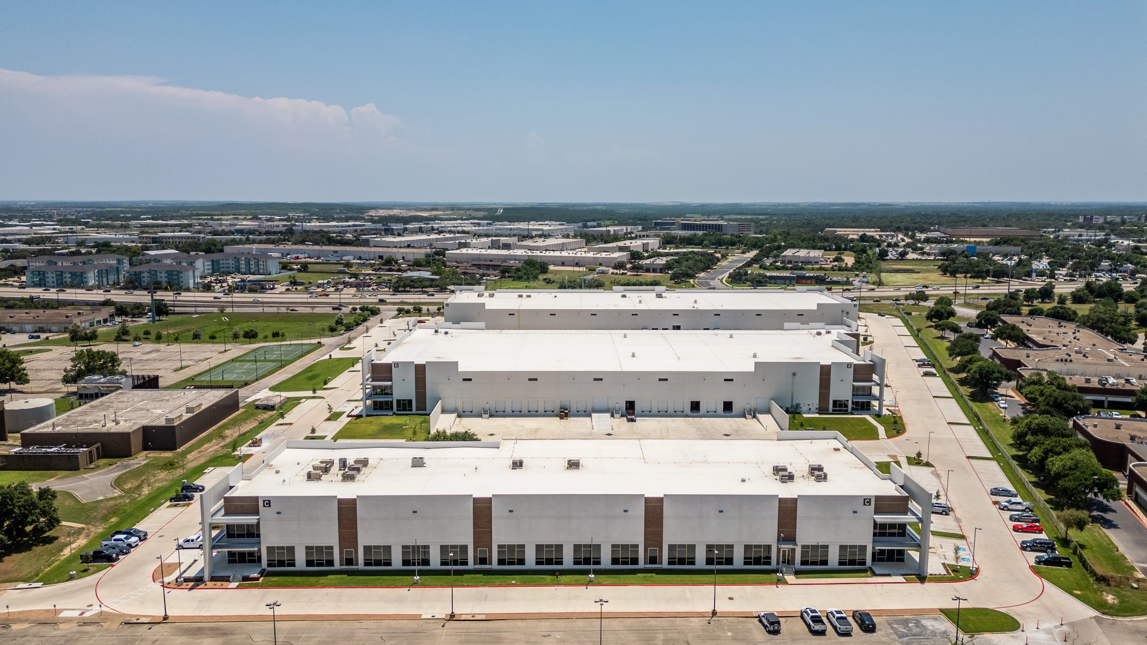Wide aerial overview of Ben White Industrial Park in Austin, Texas