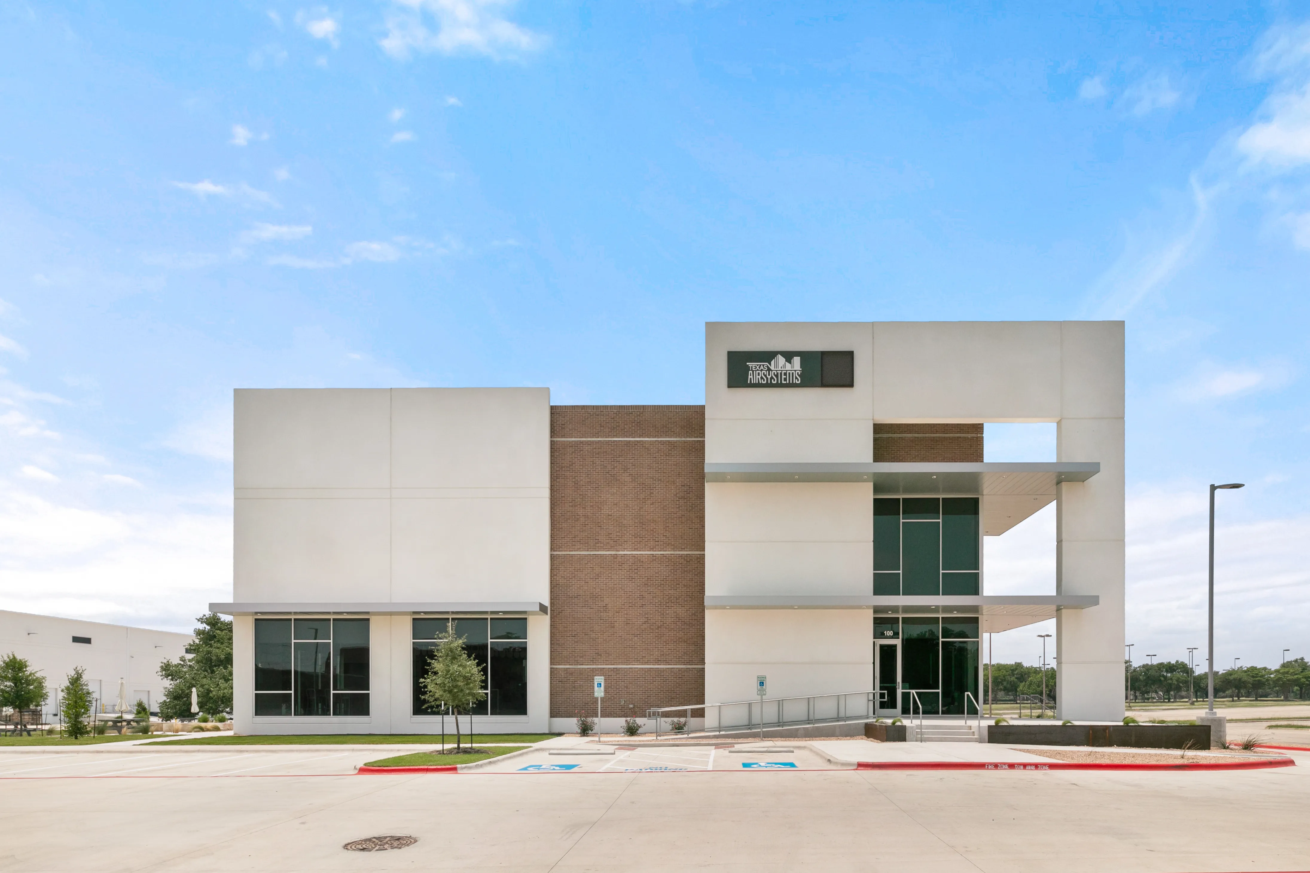Front entry with a glass facade at 5900 E Ben White