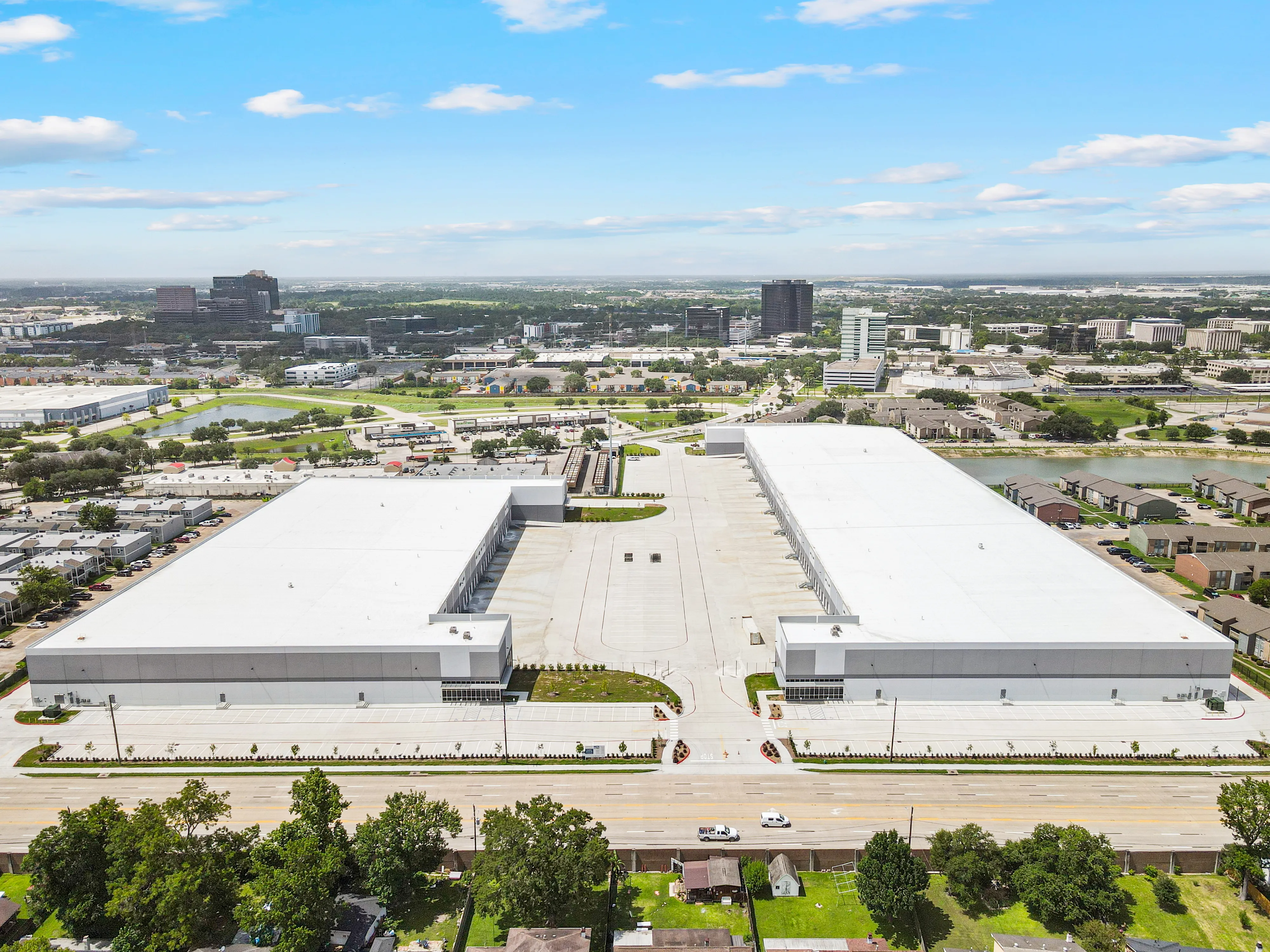 Aerial view of two long white-roofed buildings at Imperial Valley