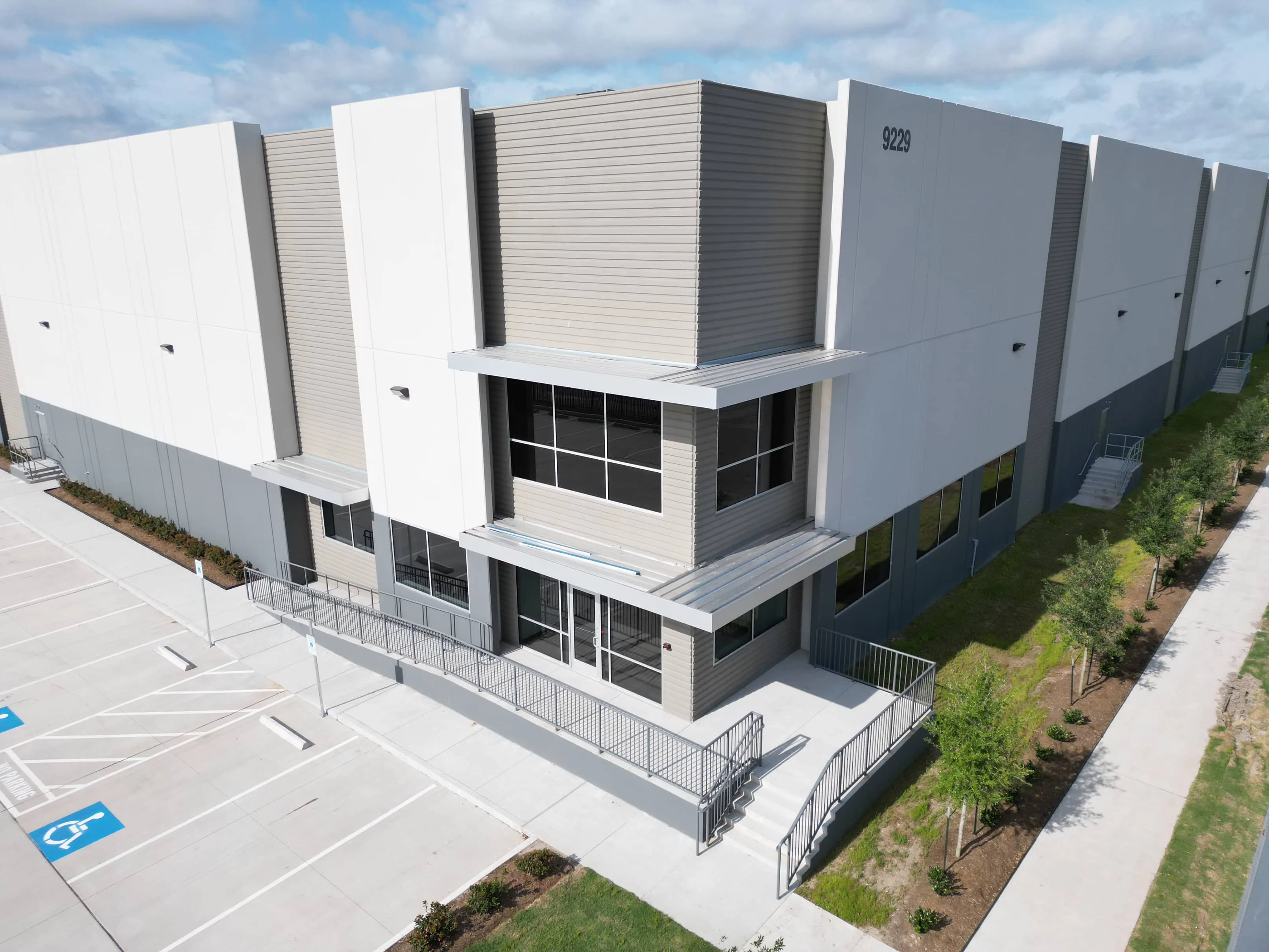 Aerial view of the facade and entrance at West X